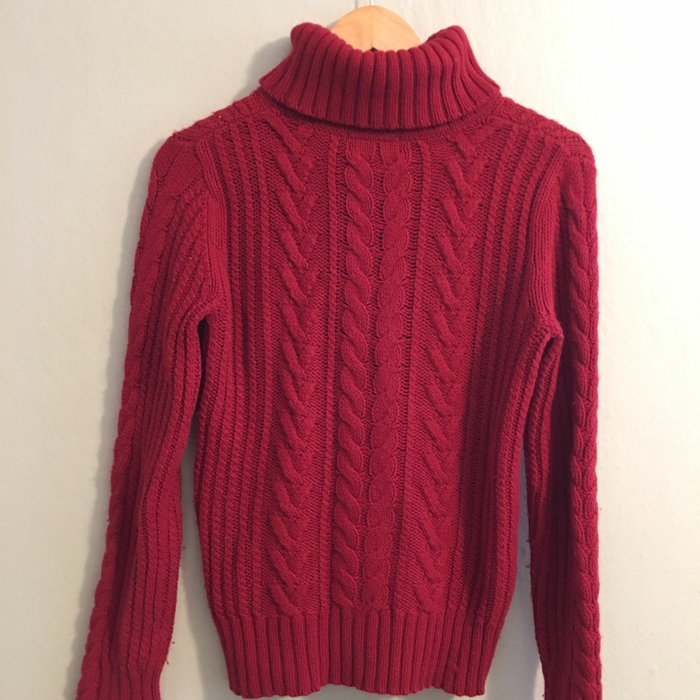 Red knitted turtleneck sweater